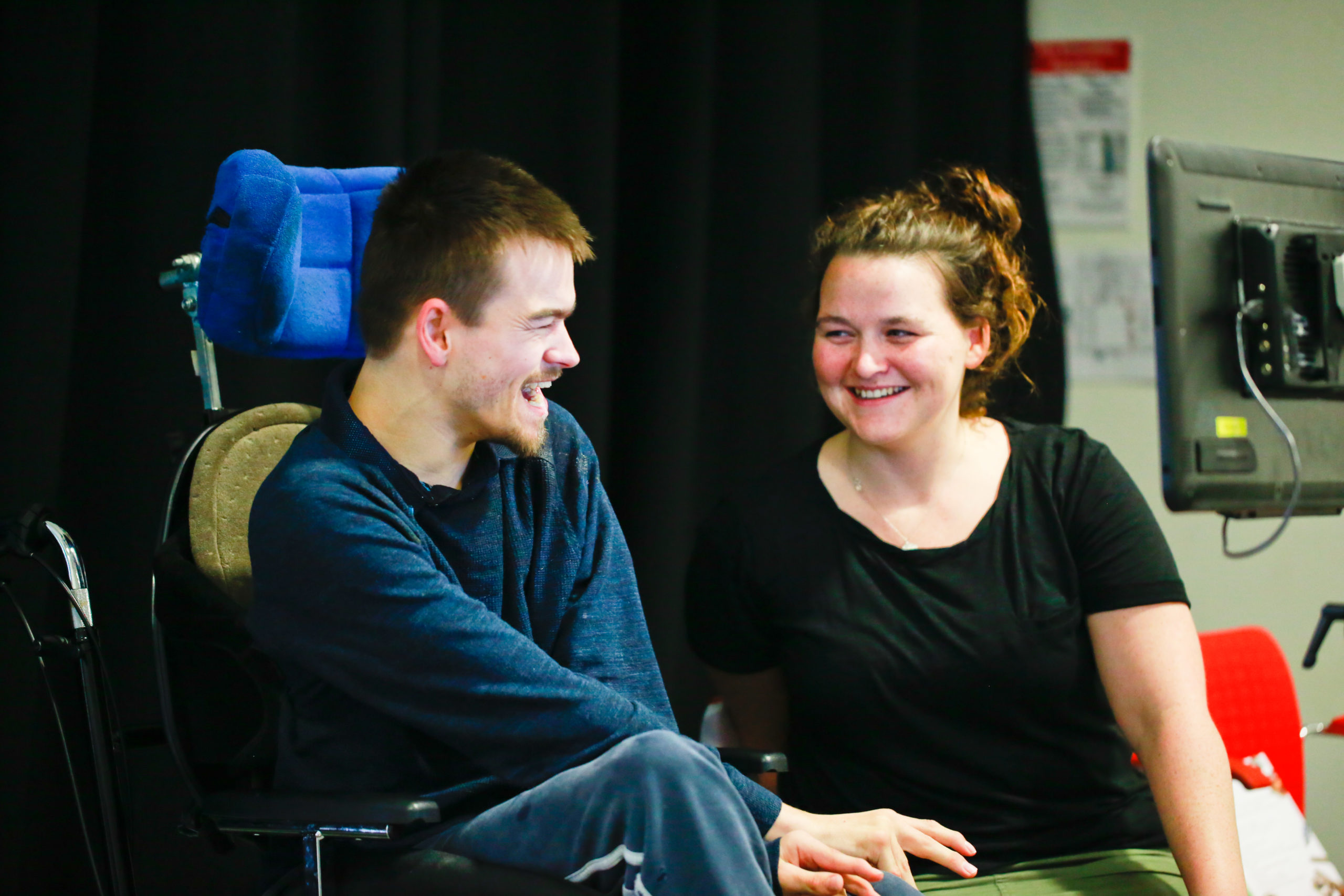 Thumbnail for the 'Case study film: Dave Young – aka The Shouting Mute' video. Dave sits and laughs with a woman.